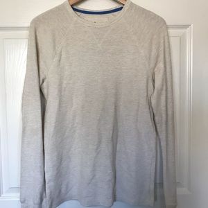 Cream colored long sleeved shirt